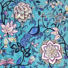 a blue background with flowers, birds and leaves on it's sides is shown