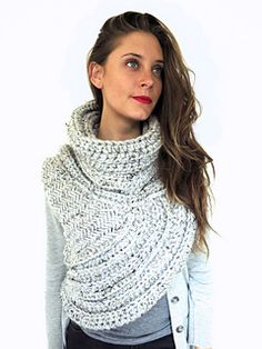 a woman wearing a white knitted scarf