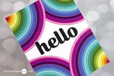 a hello card with the word hello on it in black lettering and rainbow circles around it