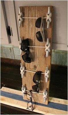 a wooden rack with pairs of shoes hanging on it