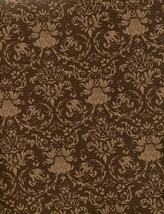 a brown and tan wallpaper with an ornate design on it's side,