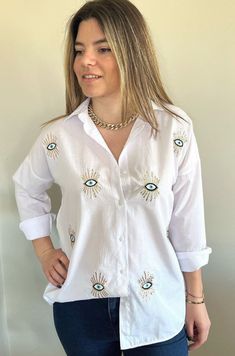 Evil Eye Blouse for Women I Evil Eye Shirt Sequin I Evil Eye Clothing I Embroidered Cotton Protect yourself and your loved ones with the power of evil eye! The evil eye brings good luck and protects you from any ill-will that could otherwise have a negative effect on your well-being or your life in general. %100 cotton Dimensions of the model: Height: 1.75, Bust: 89, Waist: 64, Hips: 92, Size: S/36/1 Sample Size: S/36/1 Evil Eye Clothes, Evil Eye Outfit, Embroidered Shirts For Women, Evil Eye Clothing, Eye Clothing, Eye Shirt, Sequin Shirt, Fashion Tops Blouse, Painted Denim