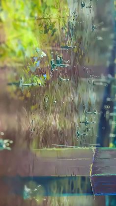 a bench sitting next to a window covered in rain