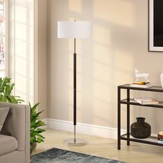 With its streamlined design and glam appeal, this floor lamp offers a versatile look that works with almost any aesthetic. Made from steel, it has a circular base with a slim center support arm with a black and gold hue for a luminous touch. It provides the ideal dedicated task or reading light, while a white linen drum shade diffuses light from a single standard bulb of up to 100W (sold separately). This lamp measures 62" tall, so it's just right for placing next to your sofa or armchair. Plus, Contemporary Floor Lamp, Lamp Store, Traditional Lamps, Contemporary Floor, Contemporary Floor Lamps, Metal Floor Lamps, Brass Floor Lamp, Light Bulb Types, Linen Shades