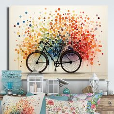 a bicycle is painted on the wall next to pillows