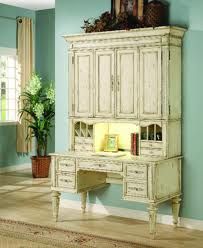 an antique white desk and hutch in a room