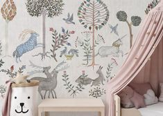 a child's room decorated in pink and white with animals, plants and trees on the wall