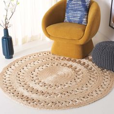 a living room with a chair and rug on the floor