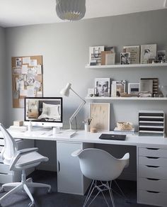 a white desk and chair in a room