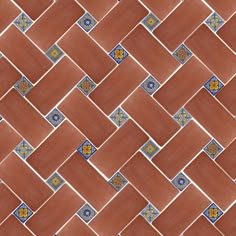 an orange and blue tile pattern with small flowers on the bottom right corner, in diagonal rows