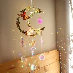 PRICES MAY VARY. 🦋Hang the beautiful big amethyst crystals suncatcher on your windows, it will liven up your room, and heal your day. 🌛Catch The Sun -- hanging window decor with 35mm colorful prism balls made of k9 Optical Glass (Not Acrylic), which will catch the light and make rainbows dancing around your room. 🔮Healing Crystals Home Decor -- hanging prism sun catcher with natural amethyst crystals, each one is unique. it positives your emotions and helps in relationships. Hanging crystals Moon Wind Chimes, Butterfly Bedroom, Rainbow Dance, Suncatcher Diy, Crystal Wind Chimes, Butterfly Crystal, Rainbow Maker, Hanging Crystals, Crystal Suncatchers