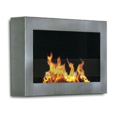 a fire burning inside of a metal wall mounted fireplace