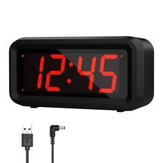 the digital clock is plugged in to an ac adapter and has a usb cable