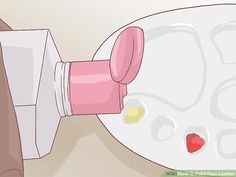 a person is pouring paint onto a white plate