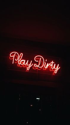 a red neon sign that says play dirty