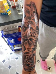 a person with a flower tattoo on their arm