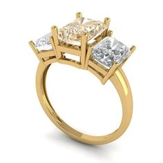 three stone engagement ring in yellow gold with two princess cut diamonds on the sides and side stones