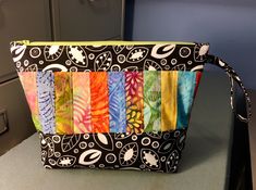 a multicolored bag sitting on top of a counter