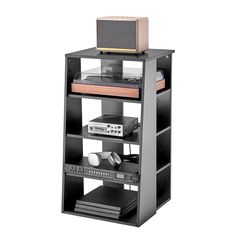 a black shelf with an electronic device on top and other electronics in the bottom shelves