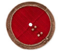 a red and brown round object with buttons on the side, isolated against a white background