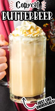 a person holding a cup with whipped cream in it and the words copy cat butterbeeer above it