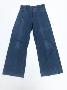 1940s USN denim uniform wide leg trousers have a button front fly, patch hip pockets, and patch back pockets one of which buttons. The stamp on the inside is visible on the right front hip, there's also a name on the inside waist Condition Overall very good with general wear. Has fray along the hems. Has a small light stain above the back right pocket and some fade on the front legs. Measurements Waist 32" Hip 39" Rise 14" Inseam 31" Length 44" Retro Wide Leg Pants With Patch Pockets, Retro Wide-leg Bottoms With Patch Pockets, Retro Wide Leg Bottoms With Patch Pockets, Vintage Cargo Jeans With Medium Wash And Pockets, Vintage Cargo Jeans With Pockets In Medium Wash, Retro Flare Jeans For Workwear, Pre-washed Wide Leg Denim Bottoms, Vintage Cargo Jeans With Pockets In Dark Wash, Vintage Dark Wash Wide Leg Cargo Jeans