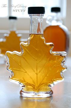 a bottle of maple syrup sitting on top of a table