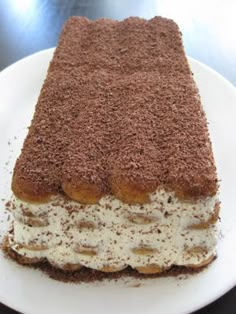 a piece of cake sitting on top of a white plate