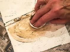 a man is using a sandpaper to paint the floor