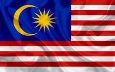 the flag of malaysia is waving in the wind and it appears to be very colorful