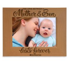 the love between a mother and son is forever engraved on a wooden frame with an image of a baby's face