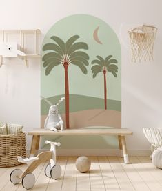 a child's room with palm trees on the wall and a wooden bench in front of it