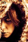 a woman's face is covered in fire and ice as she stares into the camera