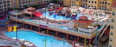 an aerial view of a water park in the middle of a large building with several slides