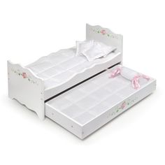 two white twin beds with pink bows on them