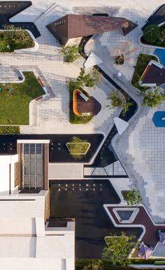 an aerial view of a building with many different shapes and sizes on the roof top