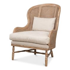 a wicker chair with a white cushion