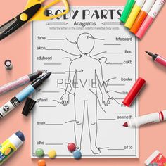 the body parts diagram is shown with markers and crayons on top of it