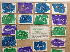 a bulletin board that has different types of writing on it, including dinosaur fossils