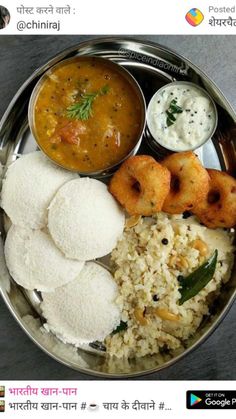 a metal bowl filled with rice and different types of food