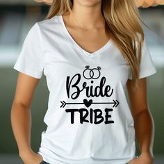 a woman wearing a white t - shirt with the words bride tribe printed on it