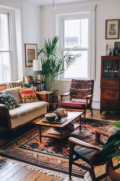 a living room filled with furniture and lots of windows next to a rug on the floor