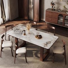 a marble dining table with chairs around it