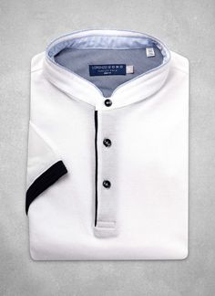 From our Perfect Polo Collection.  Inspired by the effortless style worn in Como, our Ultra-Luxurious Perfect Polo Shirt in Optic White with Banded Collar, meticulously crafted from the finest combed, pique cotton—the hand of which is super-soft and luxurious.  We have incorporated bespoke design elements such as elegant contrast fabric on the inside, complimenting the body of the polo, as well as Navy contrast buttons.  Simply the most perfect way to enjoy the warm weather. • Trim Fit • 100% Co White Polo Shirt With Polo Collar For Summer, White Polo Shirt For Summer, White Summer Polo Shirt, Fitted White Polo Shirt With Collar, Fitted White Polo Shirt, Casual White Stretch Polo Shirt, Fitted White Collared Polo Shirt, Fitted White Short Sleeve Polo Shirt, White Cotton Shirt With Placket