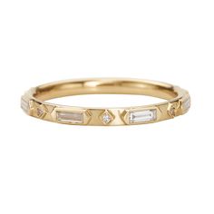 a yellow gold band with baguets and diamonds