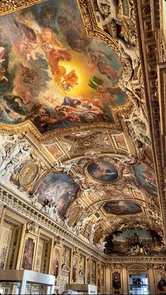 an ornate ceiling with many paintings on it