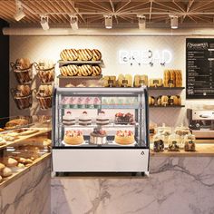 a bakery counter filled with lots of pastries