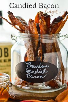 candied bacon in a glass jar with a chalkboard label