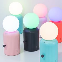 several different colored lights sitting on top of each other