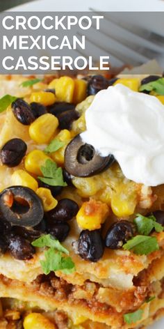 mexican casserole with black olives, corn and sour cream on the top